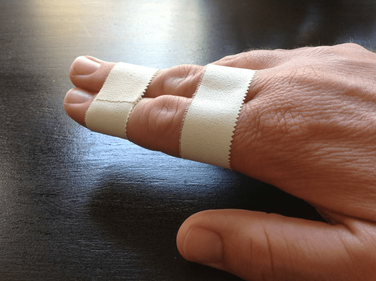 buddy taping finger taping volleyball