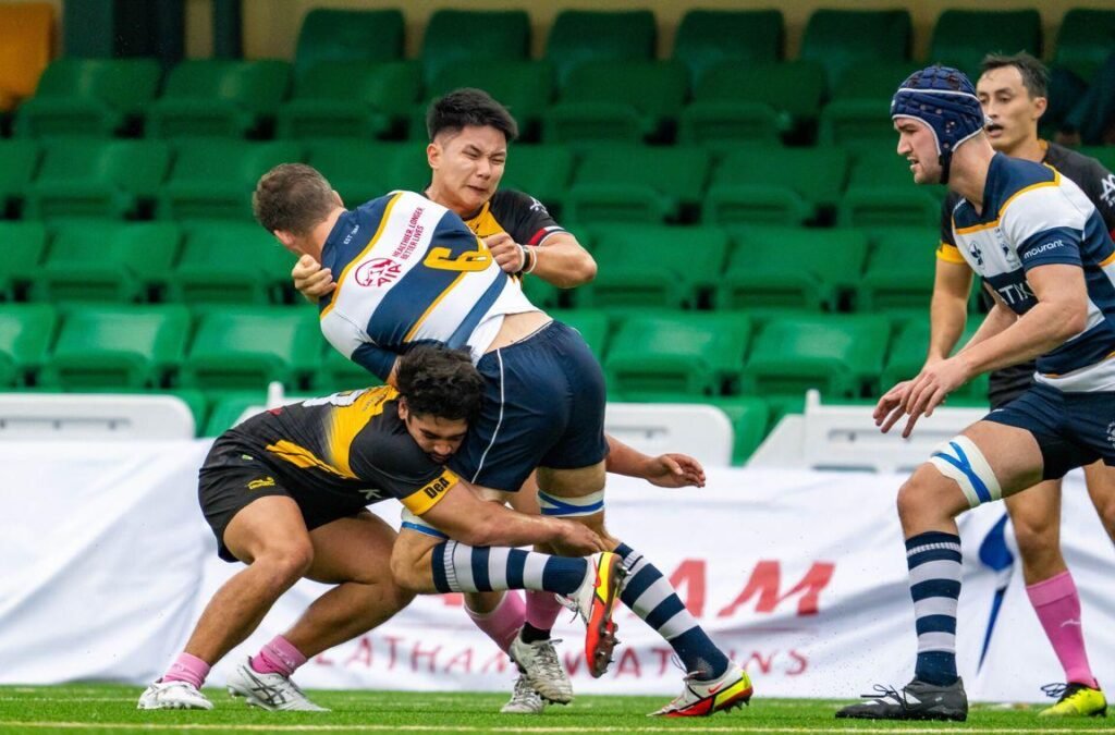 joshua bukowicki tackles a rugby player